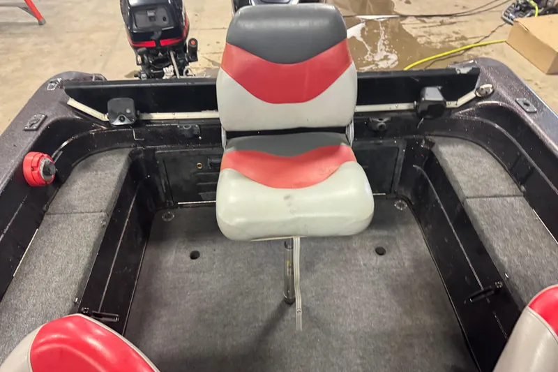Slide: The Image of 2002 Tracker Targa 2000 boat interior with red and gray seating. - 9
