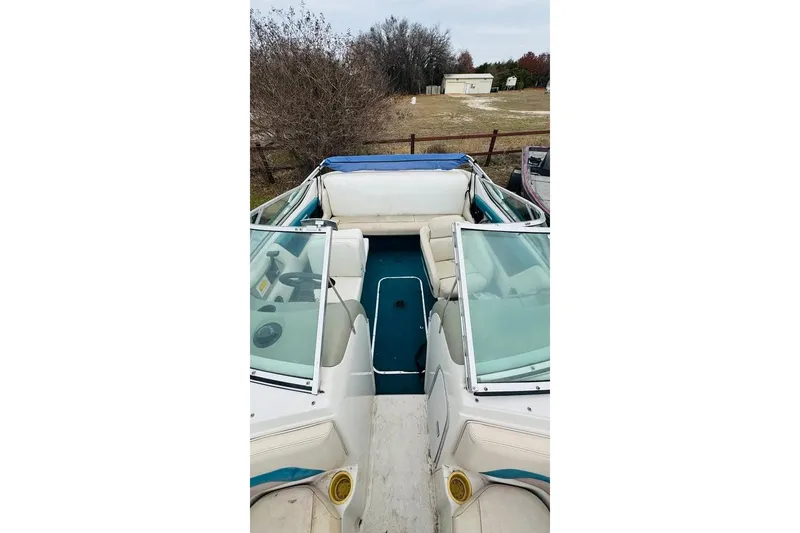 Slide: The Image of 1994 Chaparral 1930 SS boat interior with white seating and blue accents. - 3