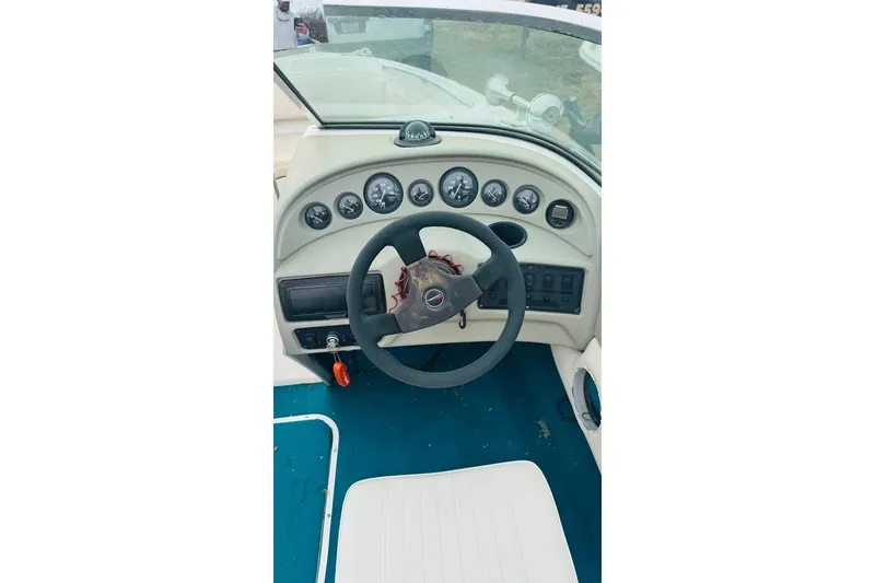 Slide: The Image of Interior dashboard of a 1994 Chaparral 1930 SS boat with steering wheel and gauges. - 7