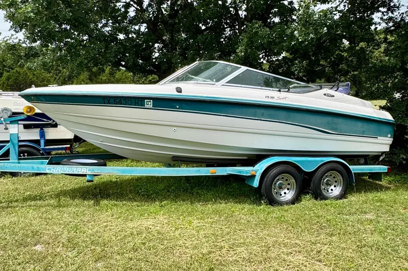 The Image of 1994 Chaparral 1930 SS boat on trailer outdoors. - 8