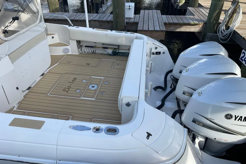Slide: The Image of 2009 Intrepid 430 Sport Yacht with Yamaha engines docked at marina. - 10