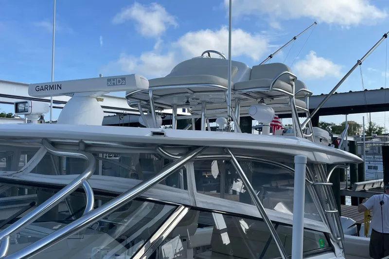 Slide: The Image of 2009 Intrepid 430 Sport Yacht with Garmin radar, docked under blue sky. - 14