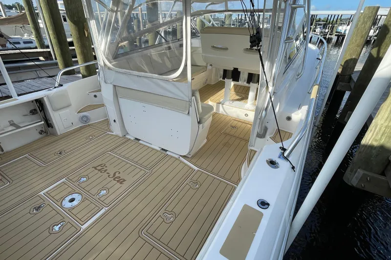 Slide: The Image of 2009 Intrepid 430 Sport Yacht with teak deck and seating area at dock. - 15