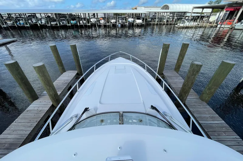 Slide: The Image of Bow view of 2009 Intrepid 430 Sport Yacht docked at marina. - 18