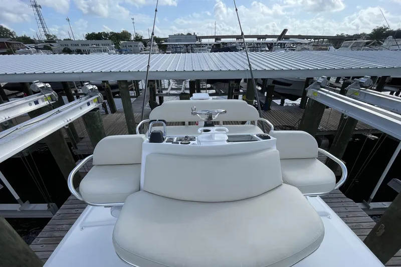 Slide: The Image of 2009 Intrepid 430 Sport Yacht helm station at marina dock. - 20