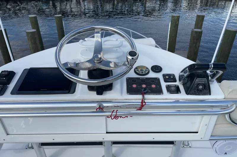 Slide: The Image of Helm of 2009 Intrepid 430 Sport Yacht with steering wheel and controls. - 21