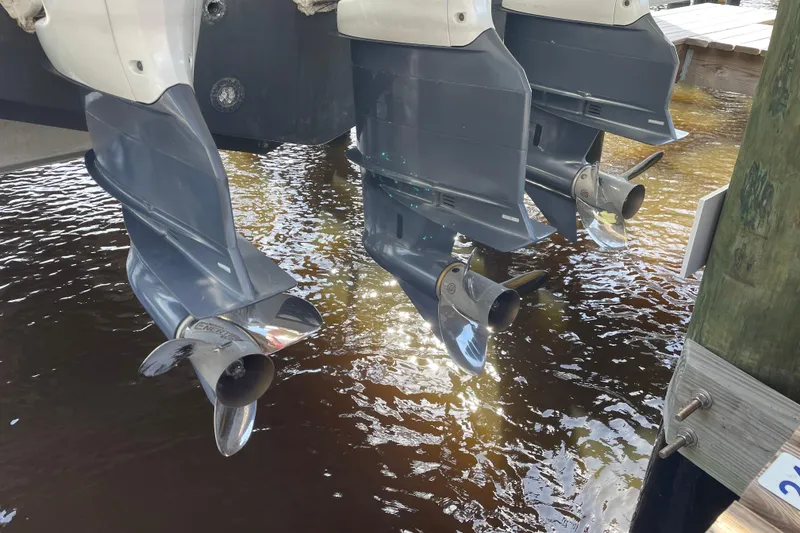 Slide: The Image of Triple outboard motors on a 2009 Intrepid 430 Sport Yacht above water. - 24