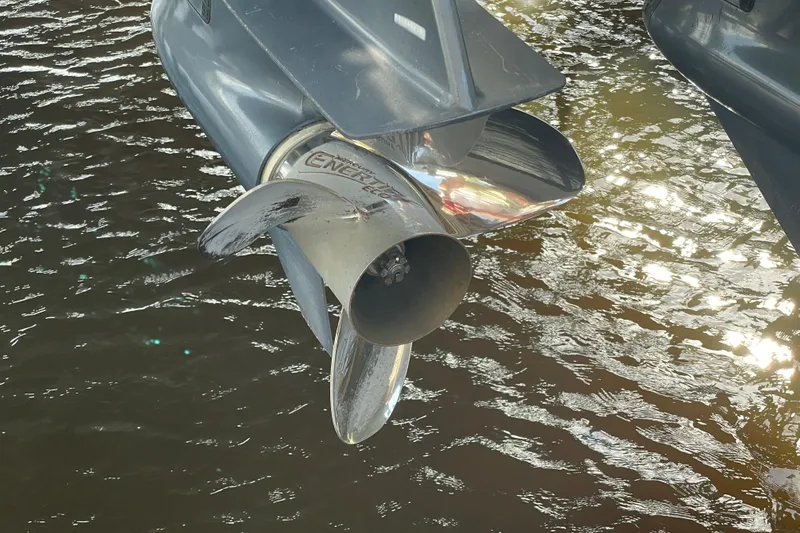Slide: The Image of Propeller of a 2009 Intrepid 430 Sport Yacht reflecting sunlight on water. - 25