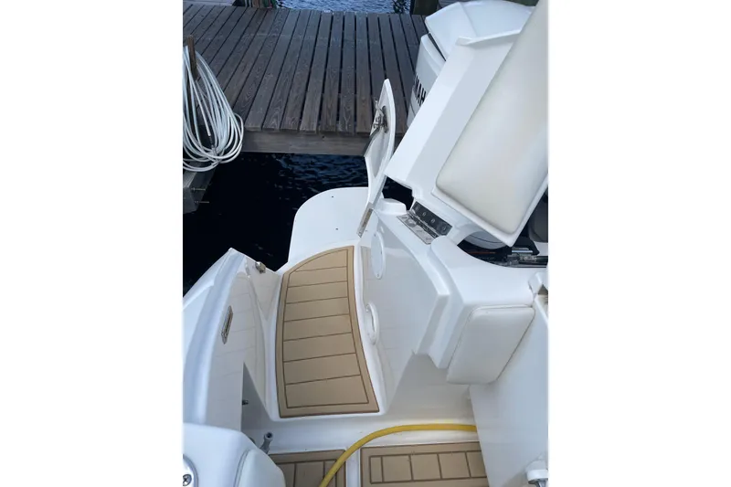 Slide: The Image of 2009 Intrepid 430 Sport Yacht deck view with open storage compartments. - 30
