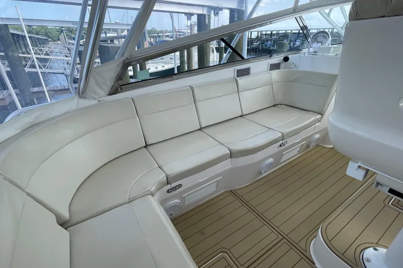 Slide: The Image of Luxurious seating area on a 2009 Intrepid 430 Sport Yacht with elegant white upholstery. - 32