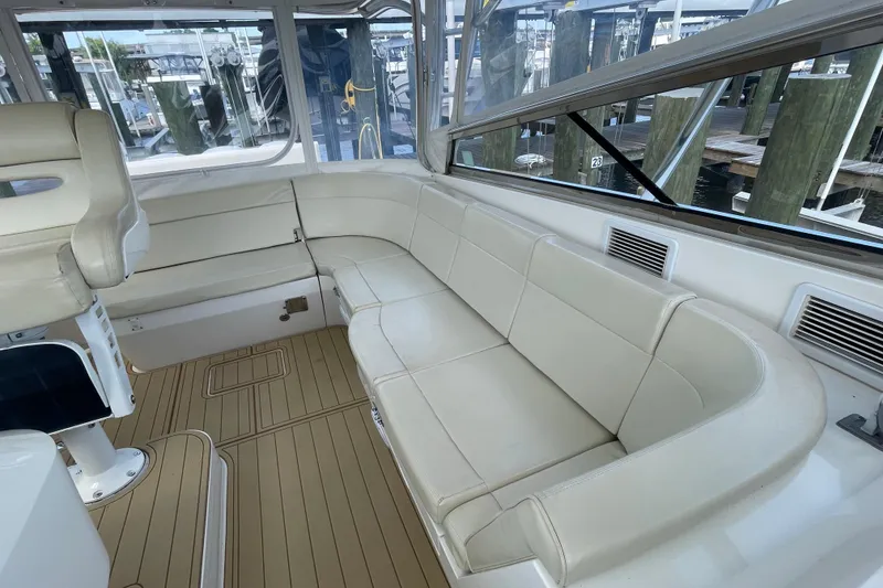 Slide: The Image of Luxurious seating area on a 2009 Intrepid 430 Sport Yacht with beige upholstery. - 34