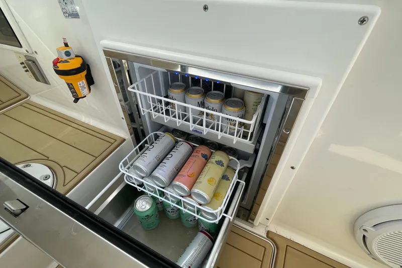 Slide: The Image of Built-in beverage cooler on 2009 Intrepid 430 Sport Yacht, stocked with assorted drinks. - 37