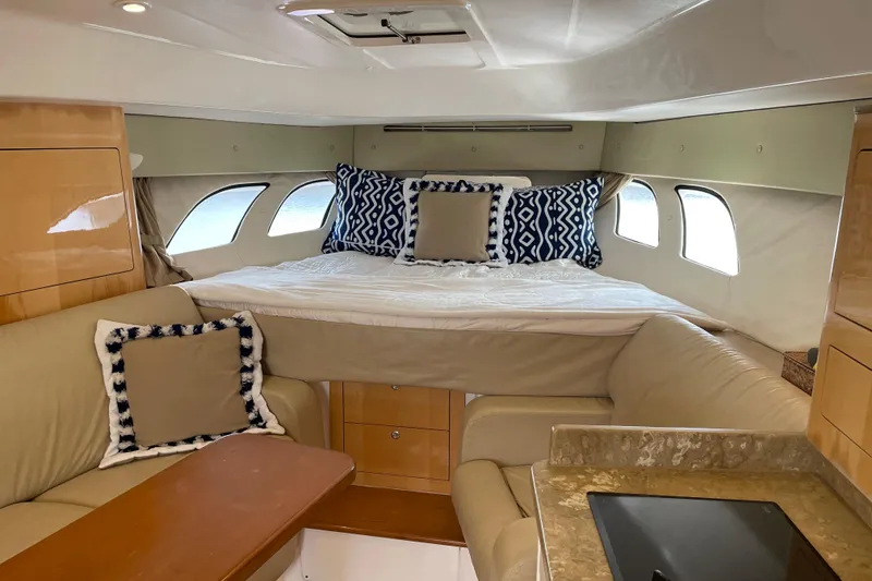 Slide: The Image of Luxurious interior of a 2009 Intrepid 430 Sport Yacht with cozy seating and stylish bedding. - 41