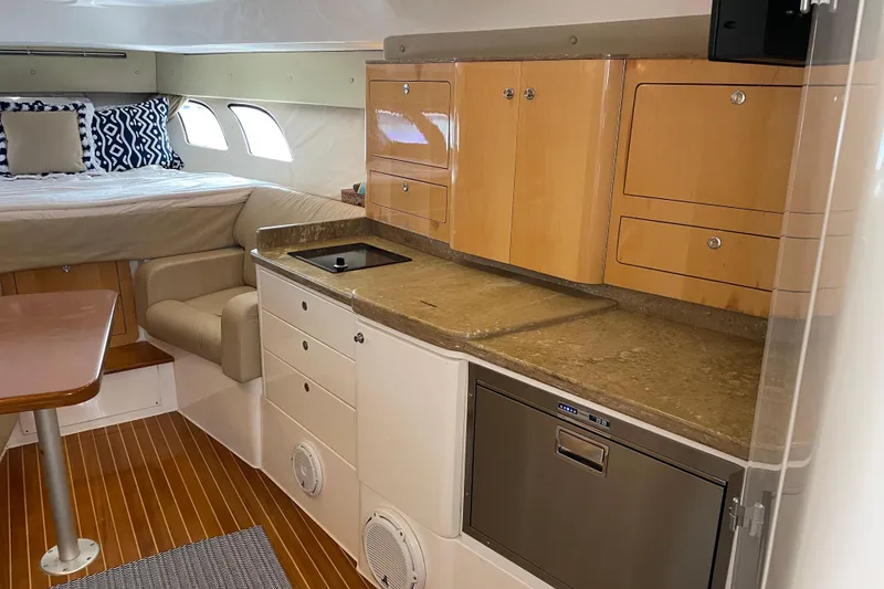 Slide: The Image of Interior of 2009 Intrepid 430 Sport Yacht with kitchenette and sleeping area. - 43