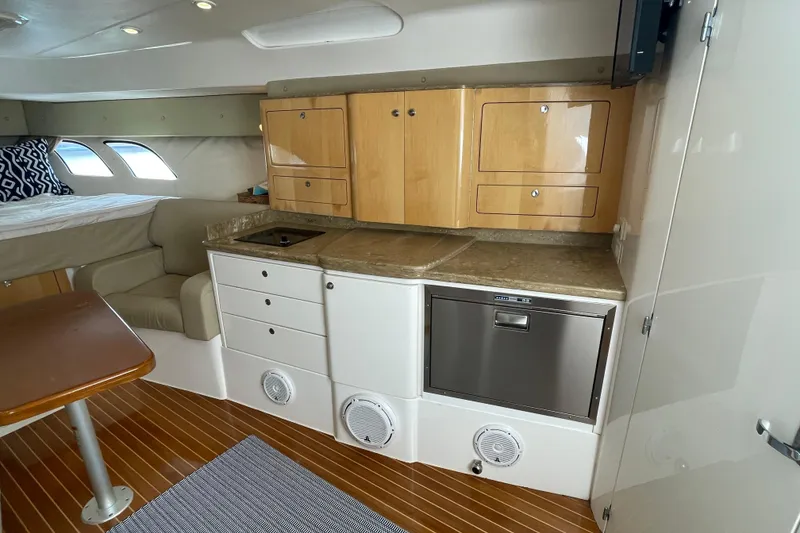 Slide: The Image of Interior of 2009 Intrepid 430 Sport Yacht with kitchenette and seating area. - 44