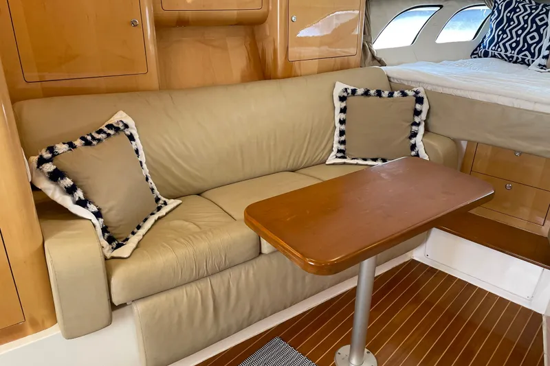 Slide: The Image of Interior of 2009 Intrepid 430 Sport Yacht with beige sofa and wooden table. - 46