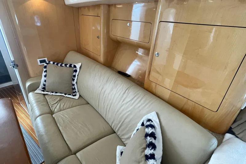 Slide: The Image of Luxurious interior of 2009 Intrepid 430 Sport Yacht with beige leather sofa and decorative pillows. - 48