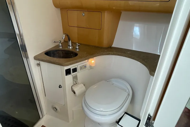 Slide: The Image of Bathroom interior of 2009 Intrepid 430 Sport Yacht with sink and toilet. - 57