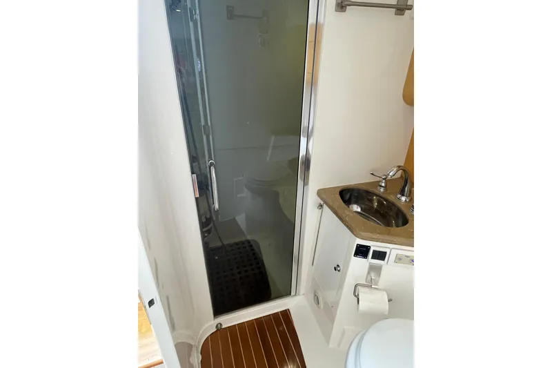 Slide: The Image of Bathroom interior of 2009 Intrepid 430 Sport Yacht with shower and sink. - 58