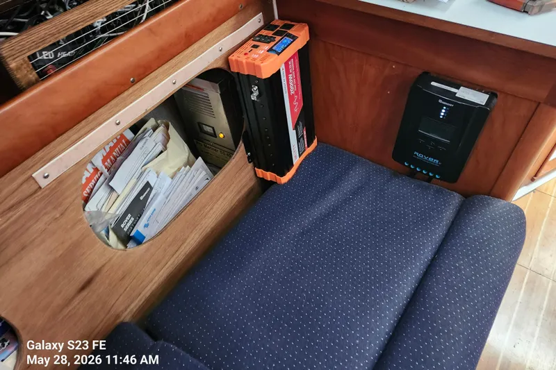 Slide: The Image of Cozy boat interior with electronics and storage, featuring a Freedom 35 model from 1995. - 20