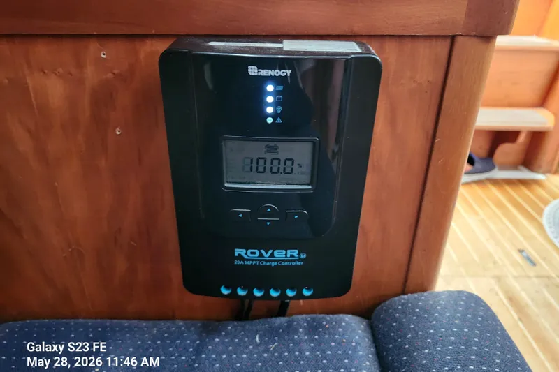 Slide: The Image of Renogy Rover charge controller on Freedom 35 yacht, 1995 model, wooden interior. - 21