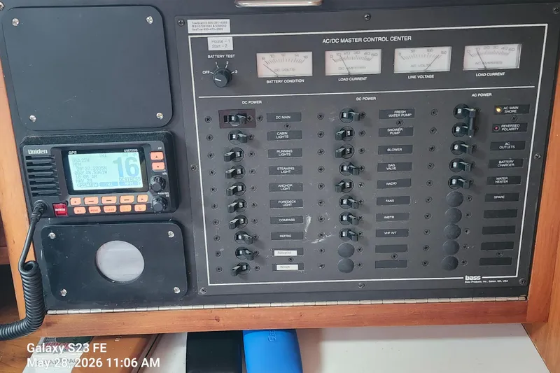 Slide: The Image of Control panel of a 1995 Freedom 35 boat with Uniden GPS and various switches. - 22