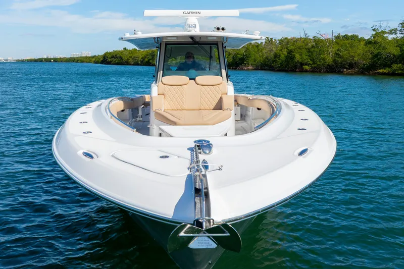 Slide: The Image of Luxury HCB 42 Lujo boat cruising on clear blue water, 2027 model. - 17