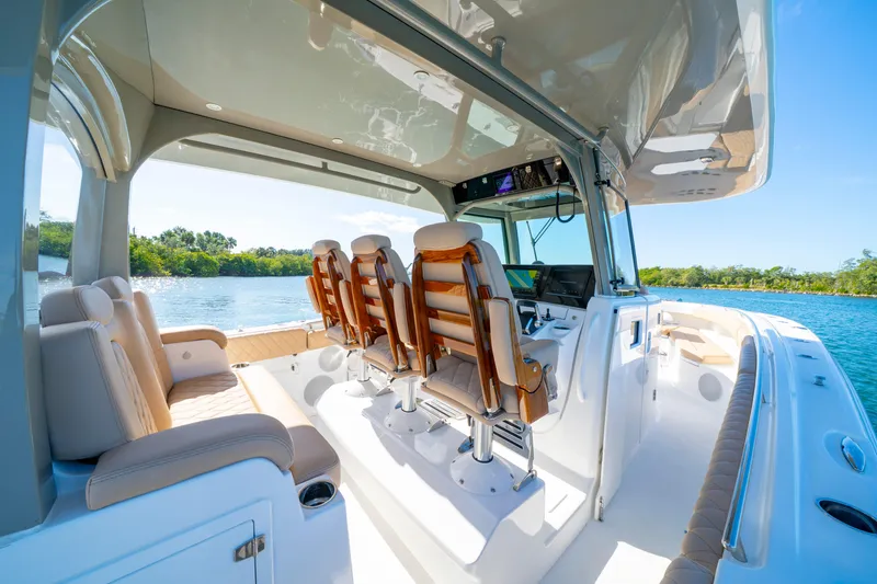 Slide: The Image of Luxurious 2027 HCB 42 Lujo boat interior with plush seating and modern helm. - 18