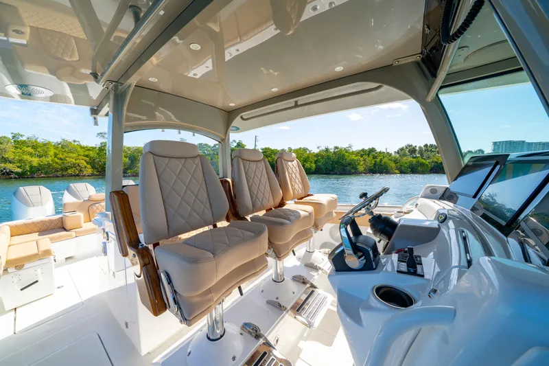 Slide: The Image of Luxurious interior of 2027 HCB 42 Lujo boat with plush seating and modern controls. - 21