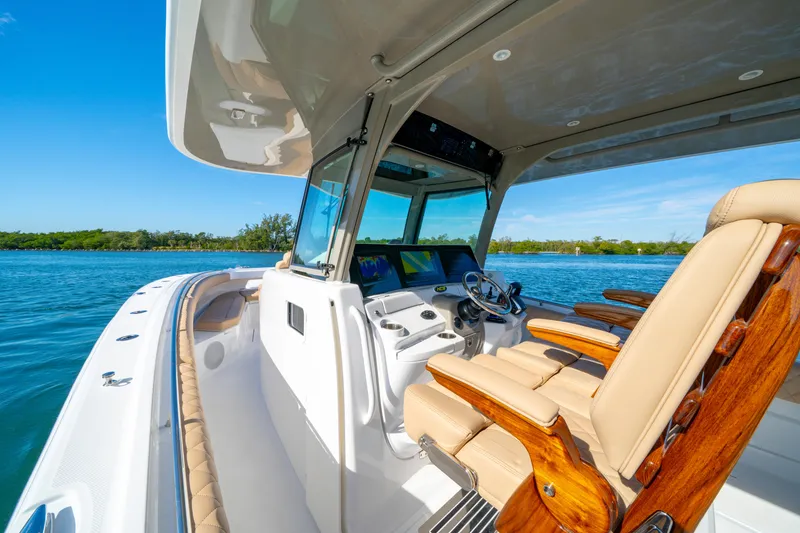 Slide: The Image of Luxury HCB 42 Lujo boat interior, 2027 model, featuring plush seating and advanced navigation. - 23