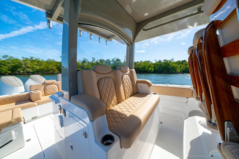 Slide: The Image of Luxurious interior of 2027 HCB 42 Lujo boat with plush seating and scenic water view. - 24