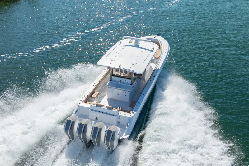 Slide: The Image of 2027 HCB 42 Lujo boat cruising swiftly on open water. - 26