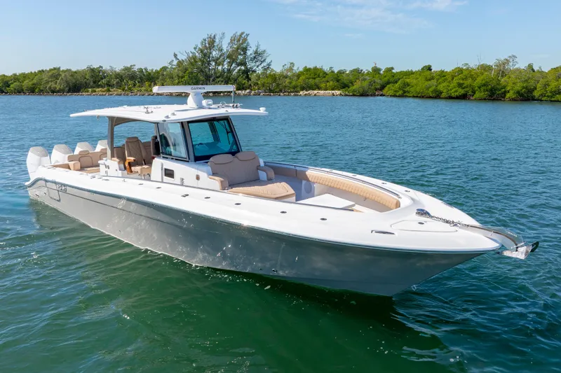 Slide: The Image of 2027 HCB 42 Lujo luxury boat cruising on a serene waterway. - 3