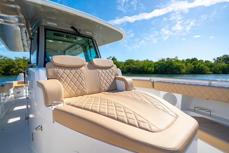 Slide: The Image of Luxurious seating on the 2027 HCB 42 Lujo boat, featuring elegant diamond-pattern upholstery. - 34
