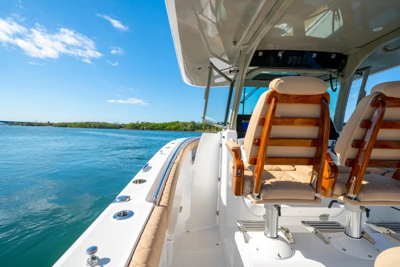 Slide: The Image of Luxurious 2027 HCB 42 Lujo boat interior with elegant seating, cruising on a sunny day. - 38