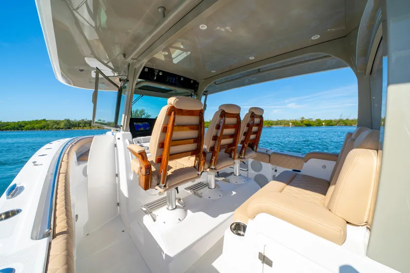 Slide: The Image of Luxurious 2027 HCB 42 Lujo boat interior with plush seating and scenic water view. - 39