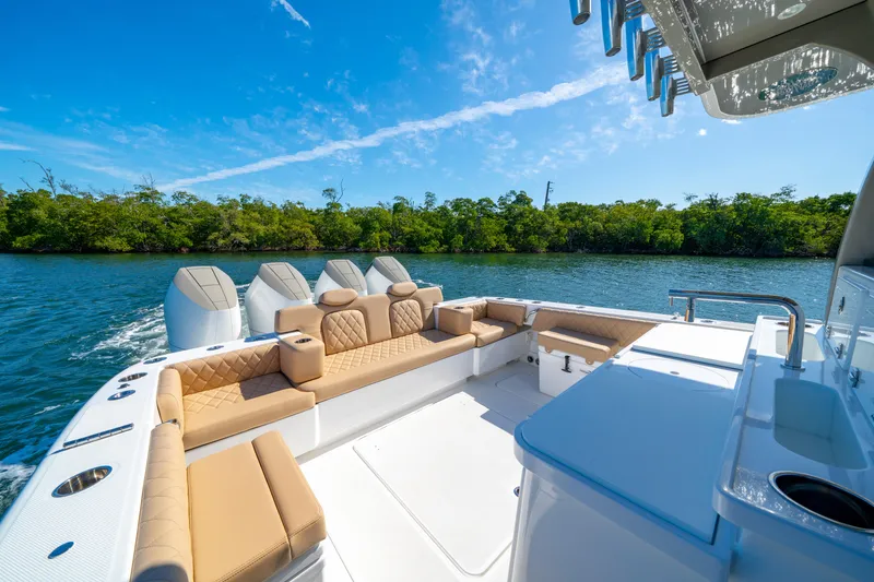 Slide: The Image of Luxurious 2027 HCB 42 Lujo boat with spacious seating and sleek design on a sunny day. - 40