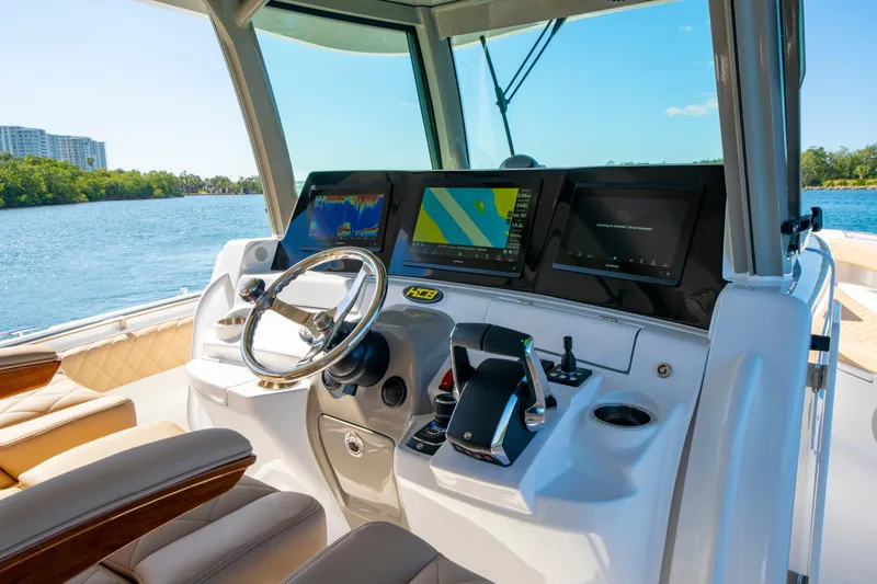 Slide: The Image of Helm of 2027 HCB 42 Lujo boat with advanced navigation displays. - 47
