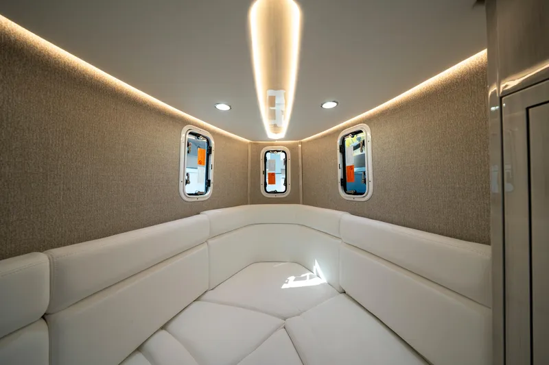 Slide: The Image of Luxurious interior of 2027 HCB 42 Lujo boat with elegant seating and ambient lighting. - 52