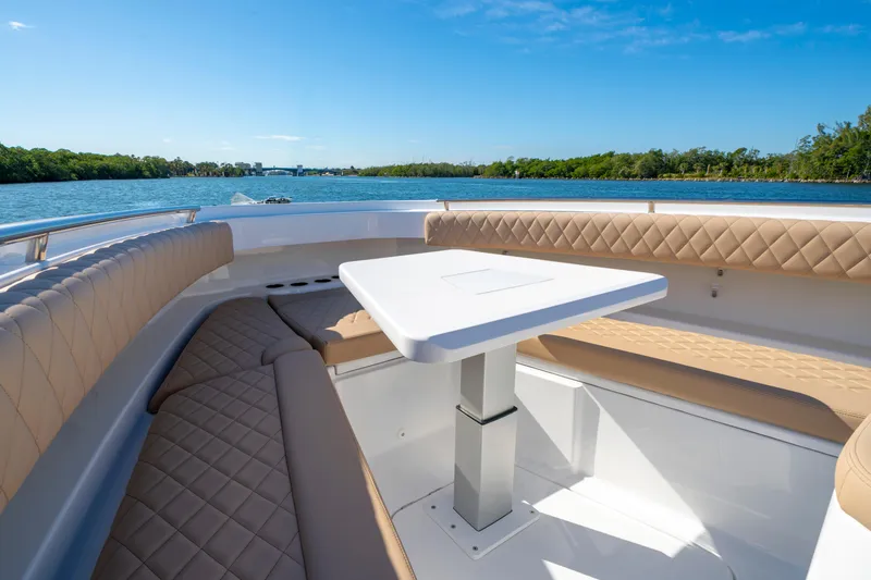 Slide: The Image of Luxurious seating area on the 2027 HCB 42 Lujo boat, with scenic water view. - 6