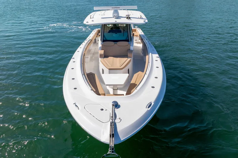Slide: The Image of 2027 HCB 42 Lujo boat on calm water, showcasing sleek design and luxury features. - 8