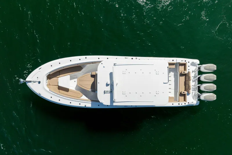 Slide: The Image of Aerial view of 2027 HCB 42 Lujo yacht on green water. - 9