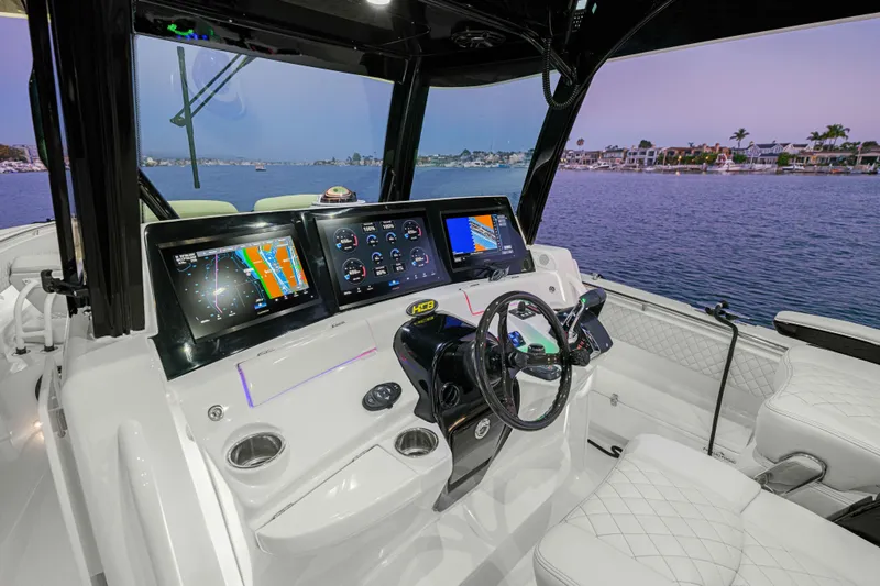 Slide: The Image of Cockpit of 2026 HCB 42 Lujo boat with advanced navigation displays and luxurious seating. - 56