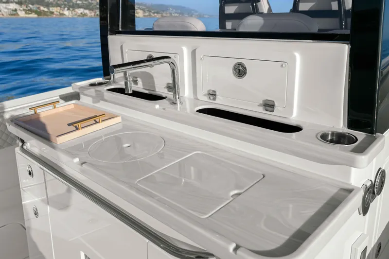 Slide: The Image of Luxury outdoor kitchen on 2026 HCB 42 Lujo boat, featuring sleek design and modern amenities. - 23