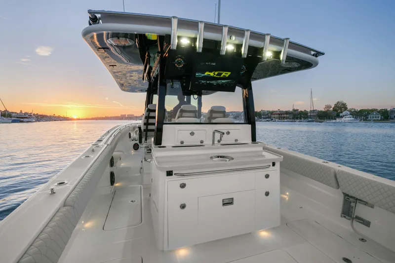 Slide: The Image of 2026 HCB 42 Lujo boat at sunset, featuring sleek design and modern amenities. - 52