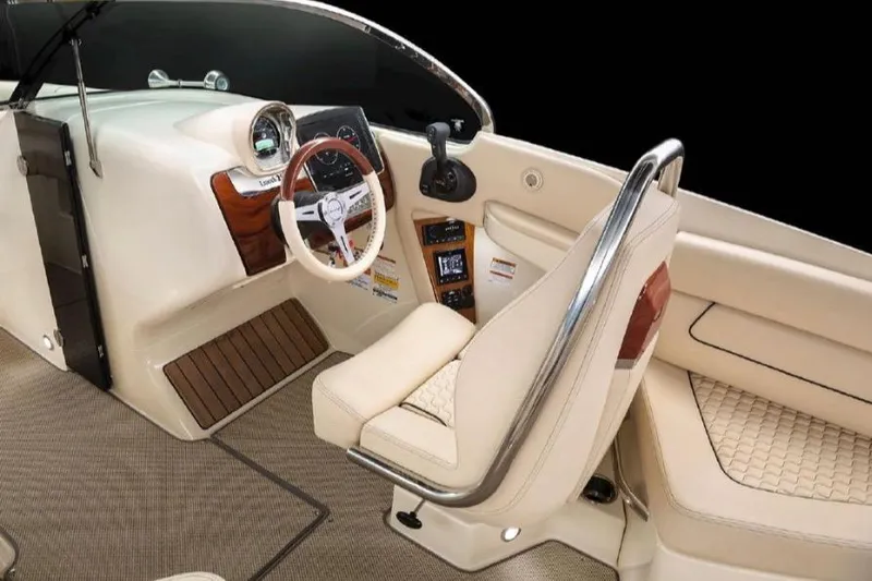 Slide: The Image of 2022 Chris-Craft Launch 25 GT interior with luxurious beige seating and sleek dashboard design. - 3