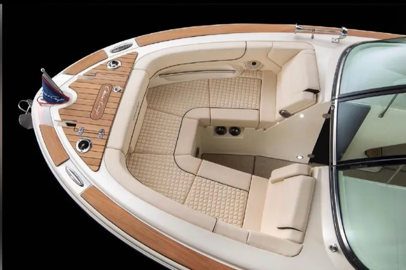 Slide: The Image of 2022 Chris-Craft Launch 25 GT boat interior with luxurious seating and wood accents. - 4