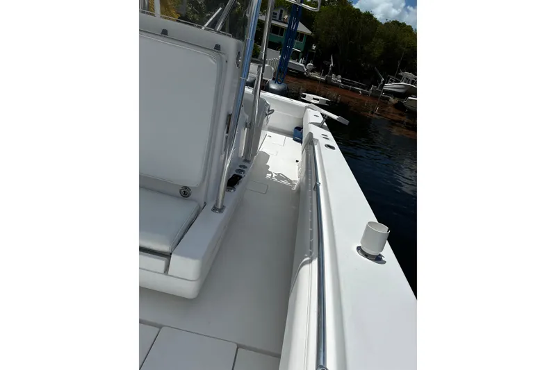 Slide: The Image of 2007 Contender 33 Tournament boat interior, featuring sleek white seating and polished railings. - 11