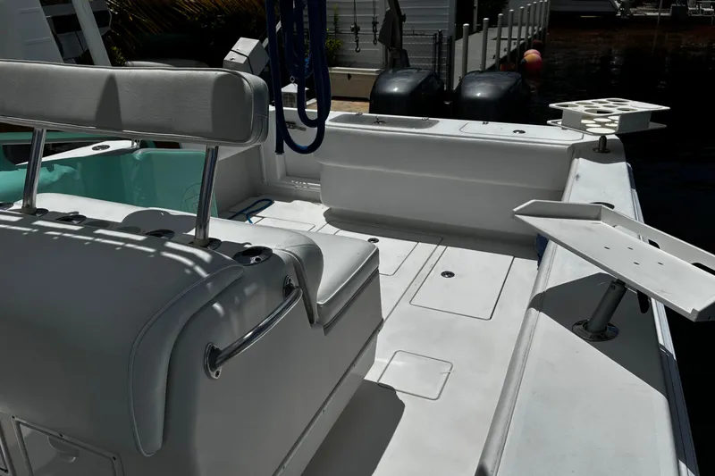 Slide: The Image of 2007 Contender 33 Tournament boat interior with seating and fishing rod holders. - 12