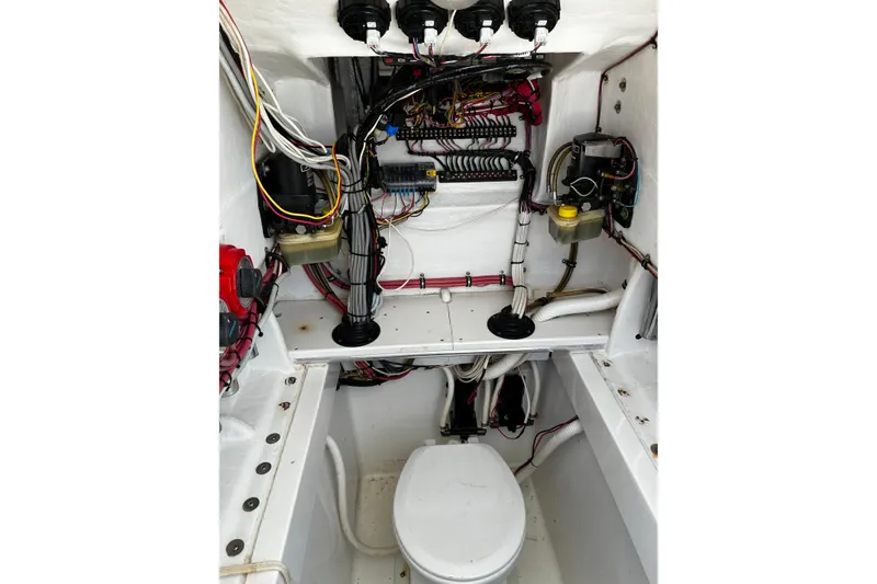 Slide: The Image of 2007 Contender 33 Tournament boat interior showing wiring and plumbing setup. - 15